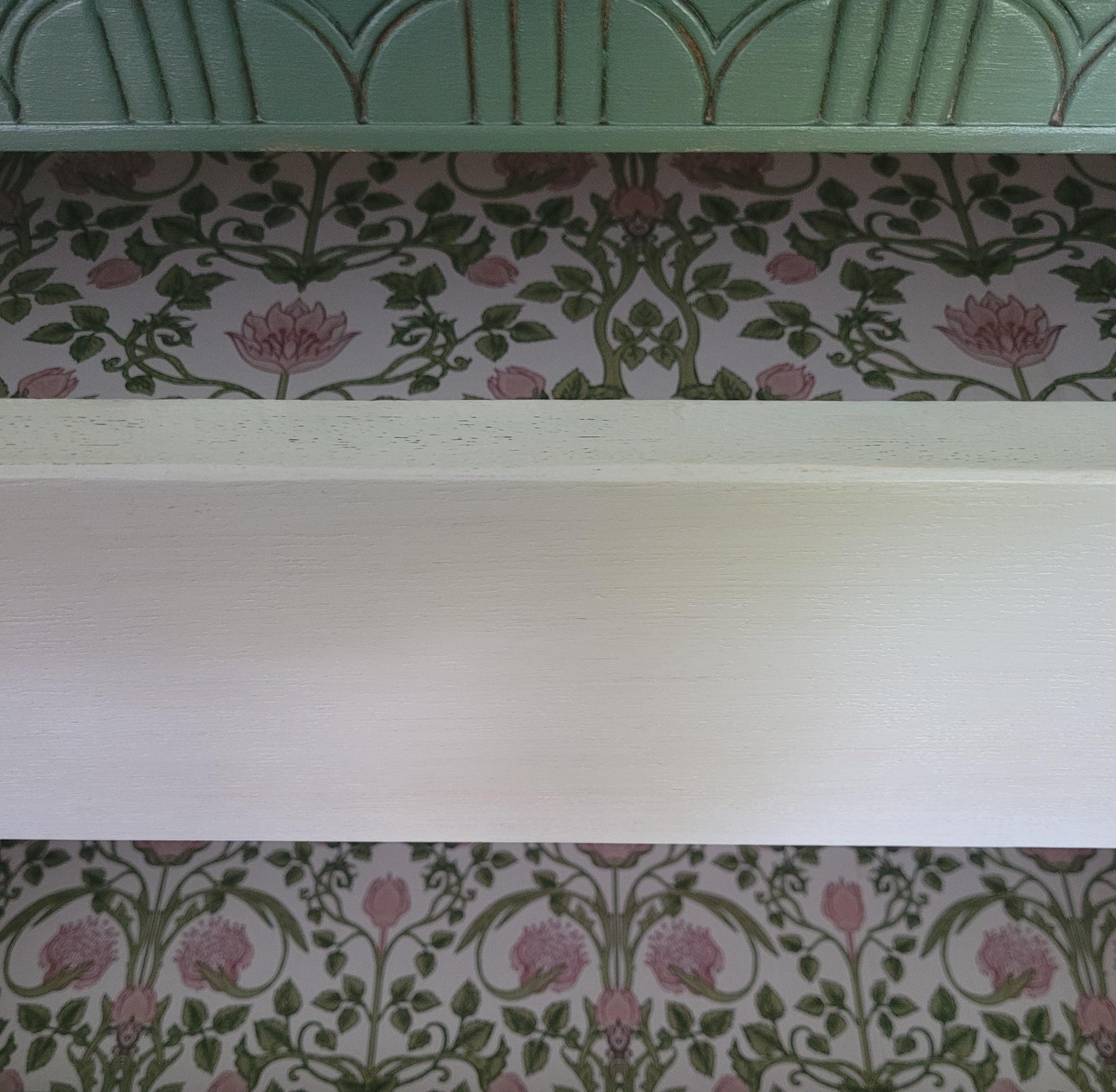 Lebus chest of drawers painted Bayberry with Algonquin wash and black scarab handles; five drawers with floral liners.