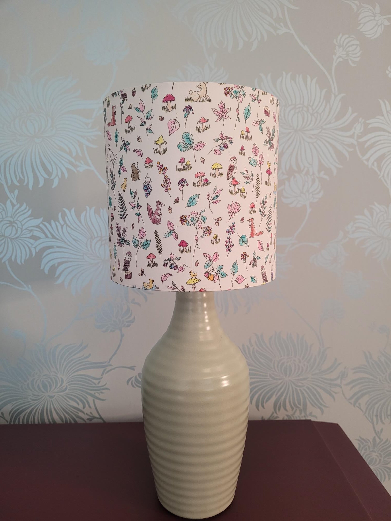 Handmade Liberty London animal and woodland themed drum lampshade featuring woodland animals, floral patterns, foliage and country-inspired design, perfect for children's rooms, nurseries, or playrooms - hand made at 15cm diameter.