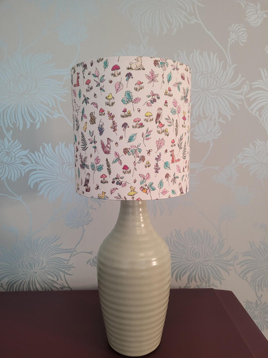 Handmade Liberty London animal and woodland themed drum lampshade featuring woodland animals, floral patterns, foliage and country-inspired design, perfect for children's rooms, nurseries, or playrooms - hand made at 15cm diameter.