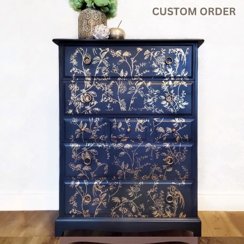 Available for sourcing and custom order - Elegant upcycled navy blue chest of drawers featuring a delicate, hand-painted gold floral design. The drawers are accented with intricate gold knobs, making this piece a sophisticated addition to any living room, bedroom, or hallway.