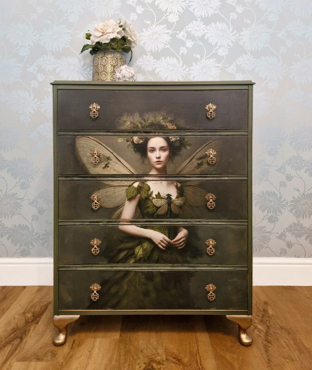 Ethereal fairy decoupage  chest in mossy Bayberry with bronze hardware, styled in a calm bedroom setting.