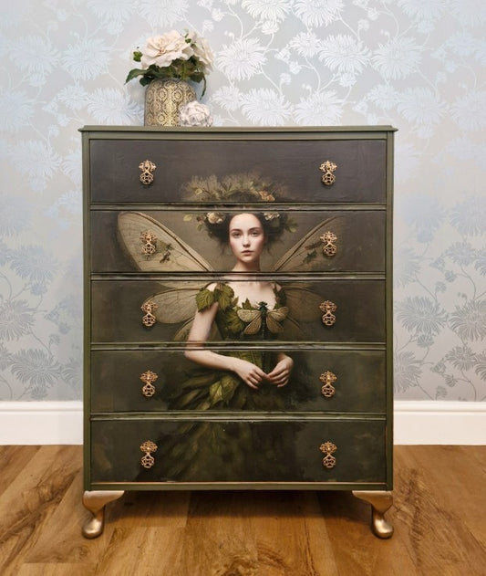 Ethereal fairy decoupage  chest in mossy Bayberry with bronze hardware, styled in a calm bedroom setting.