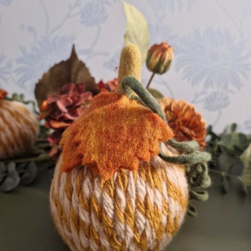 White and grey needle-felted wool pumpkin with leaf and upright stem, 11×11×15cm.