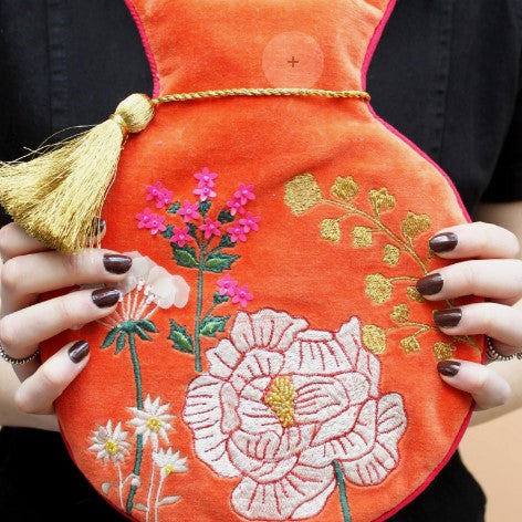 Posy orange velvet embroidered hot water bottle with beads, gold tassel and hot-pink reverse, 800ml