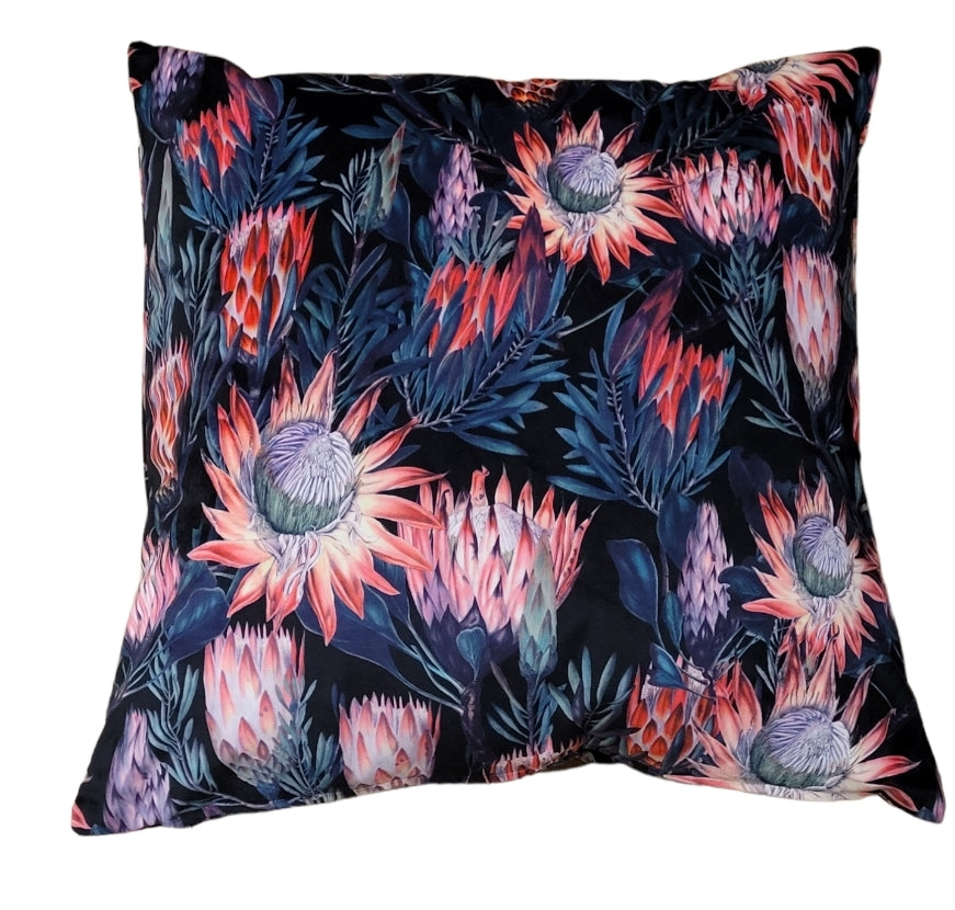 Handmade protea floral velvet cushion, 45cm scatter pillow in coral, pink, and navy with feather inner.