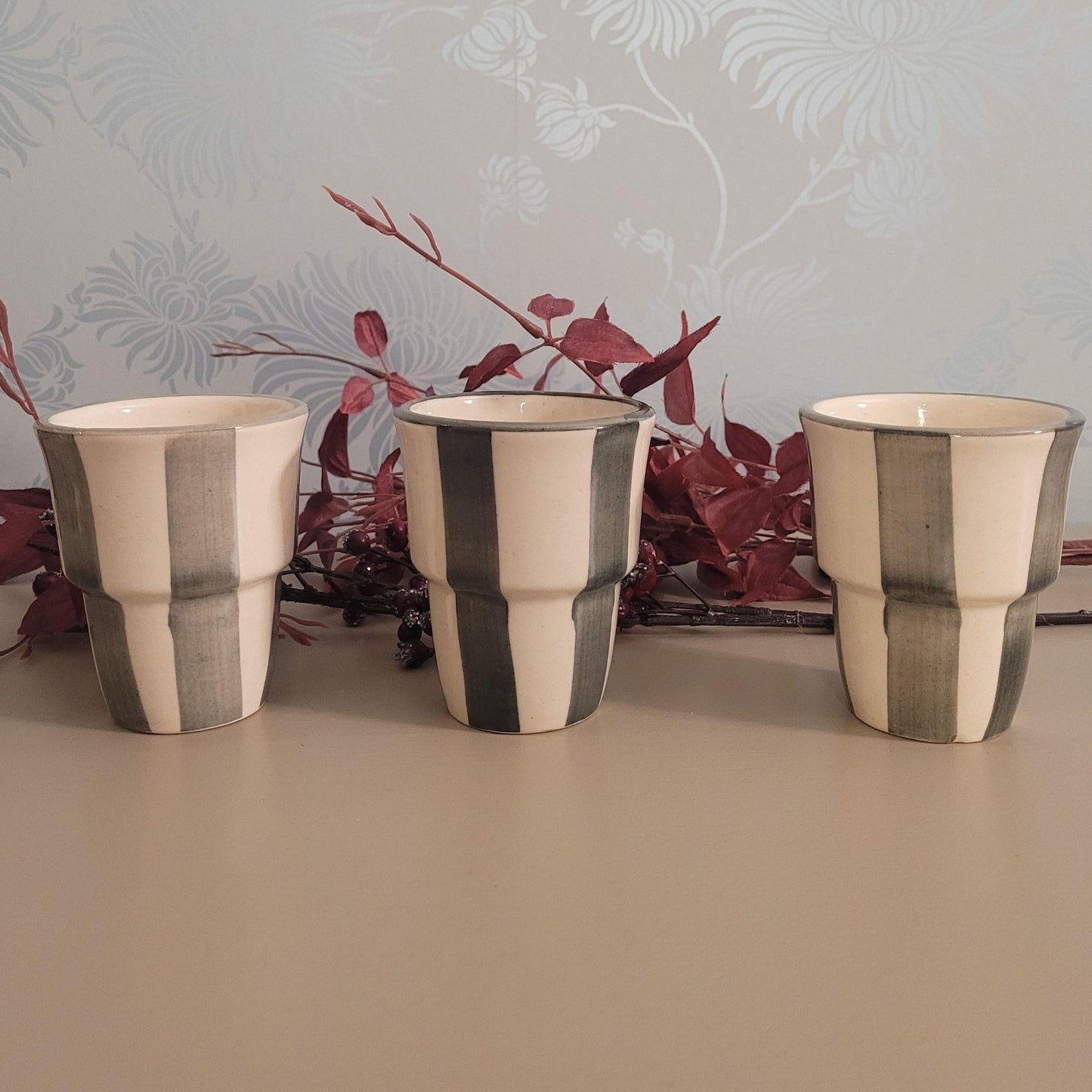 Stoneware handleless coffee beaker with green and cream Scandi stripes, 180ml.