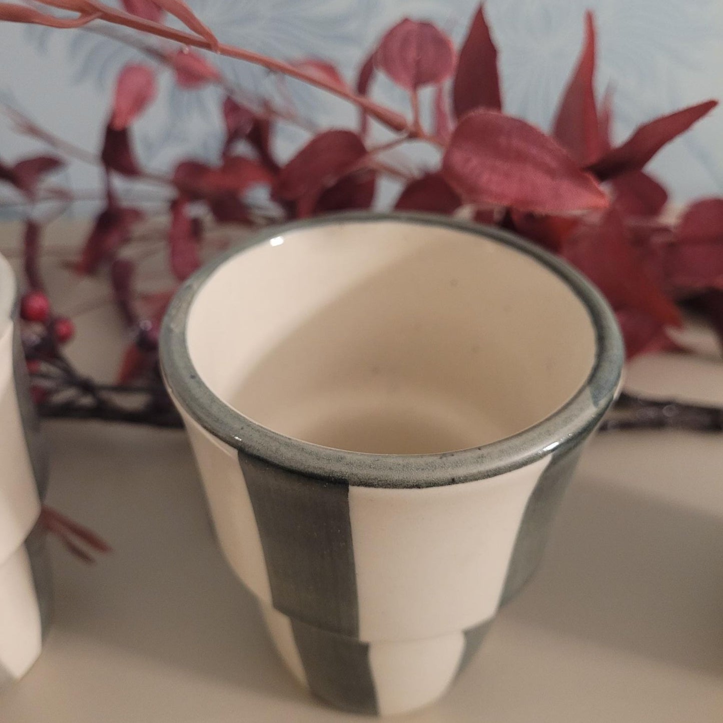 Stoneware handleless coffee beaker with green and cream Scandi stripes, 180ml.