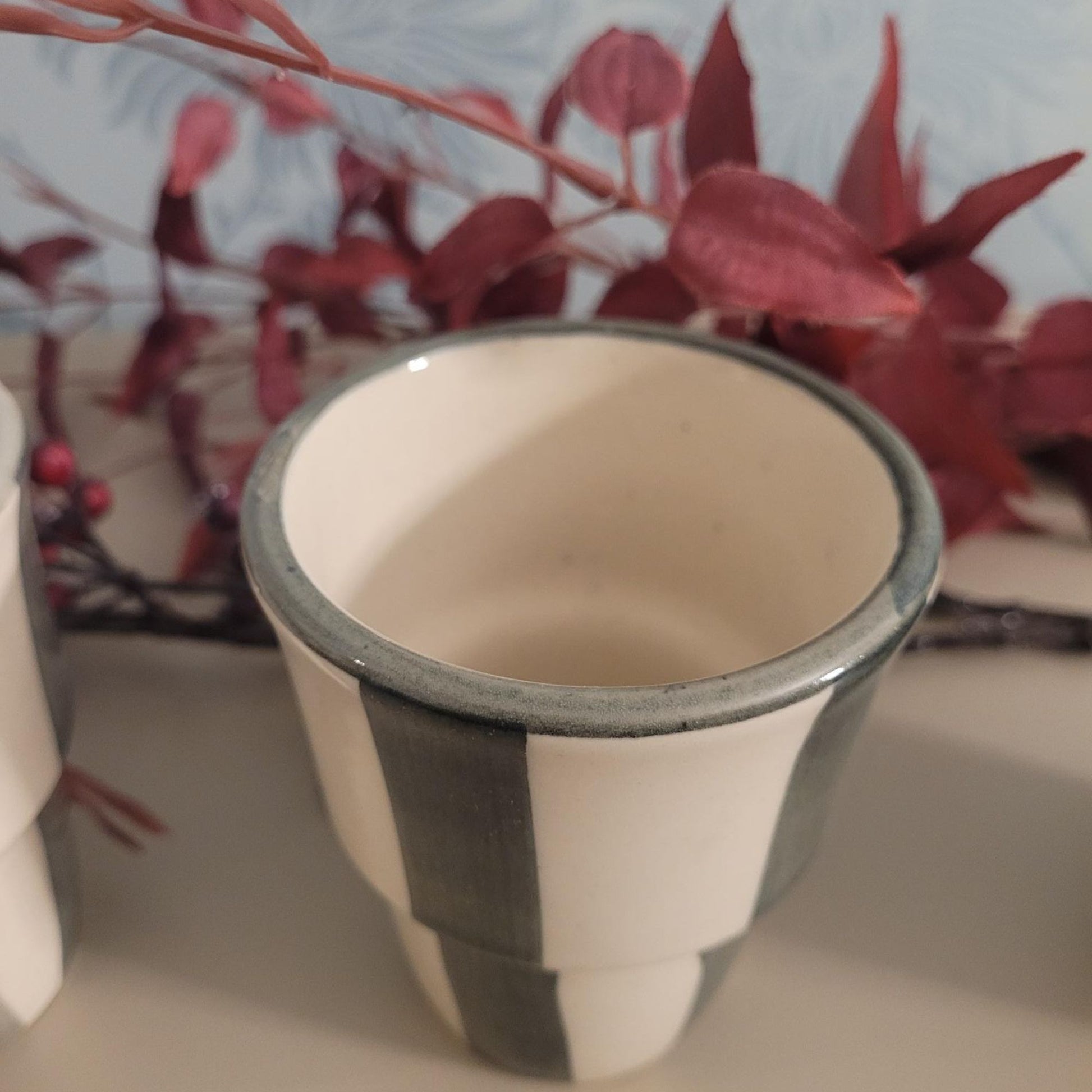 Stoneware handleless coffee beaker with green and cream Scandi stripes, 180ml.