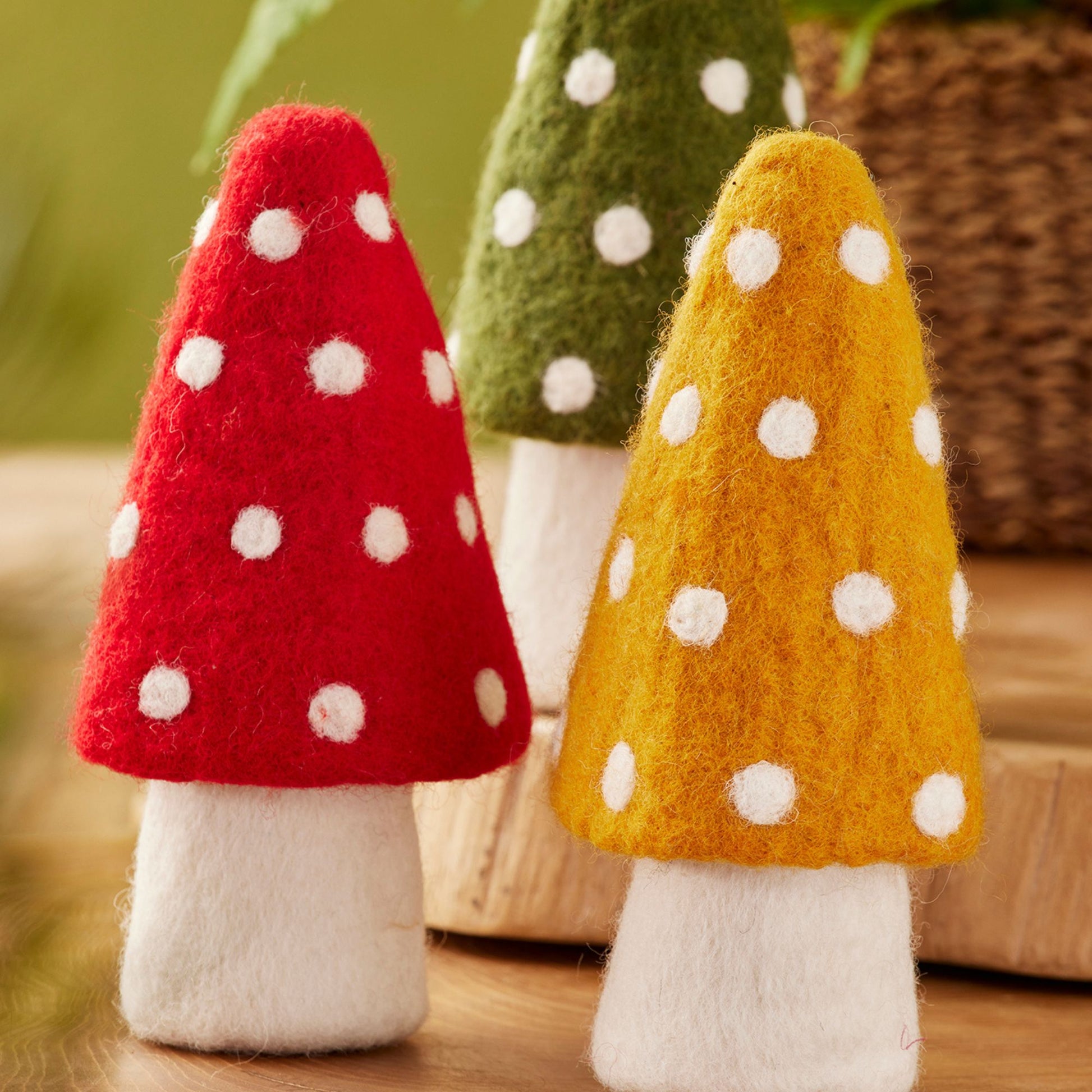 Handcrafted felt mushroom ornament, 19cm, 100% wool with white polka-dot cap; made in Nepal.