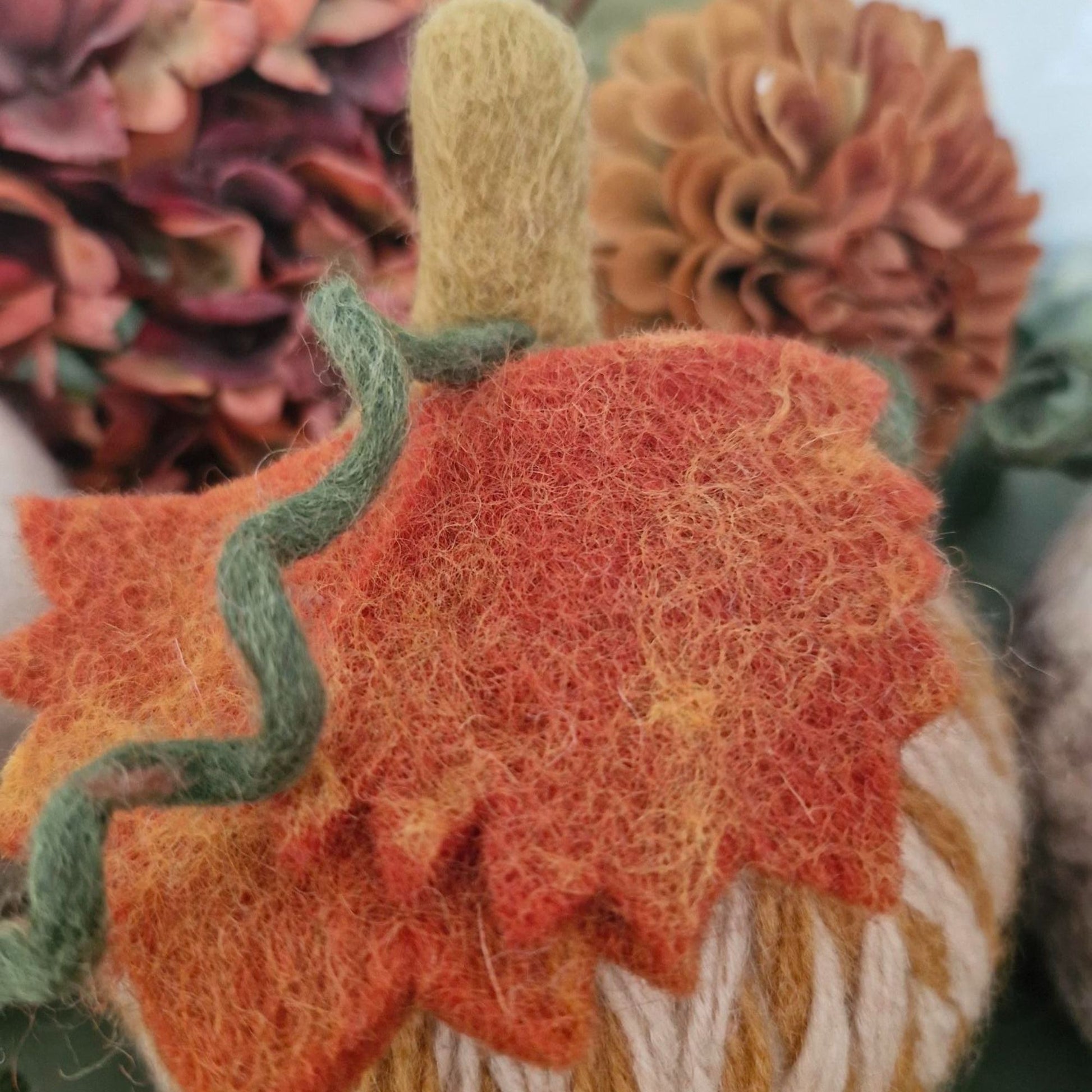 White and grey needle-felted wool pumpkin with leaf and upright stem, 11×11×15cm.