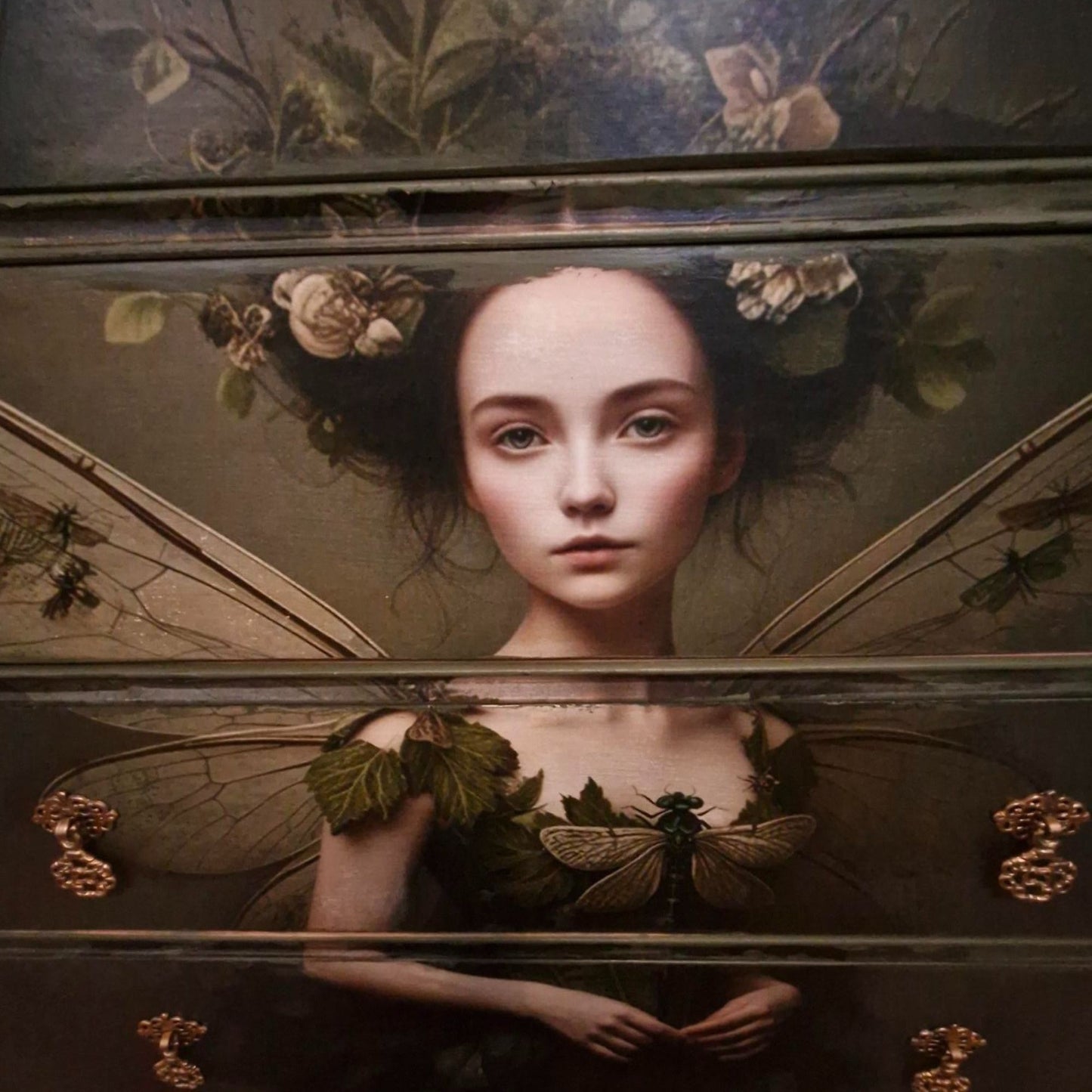 Ethereal fairy decoupage  chest in mossy Bayberry with bronze hardware, styled in a calm bedroom setting.