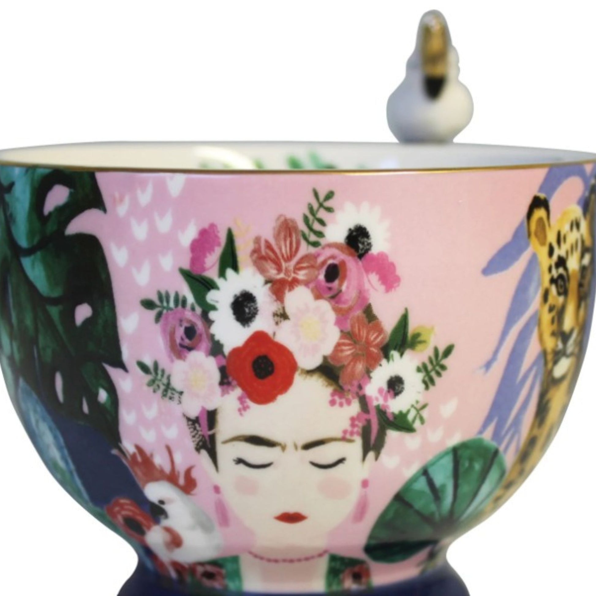Frida Kahlo tropical porcelain mug with gold parakeet handle, gold signature and leaf print inside.
