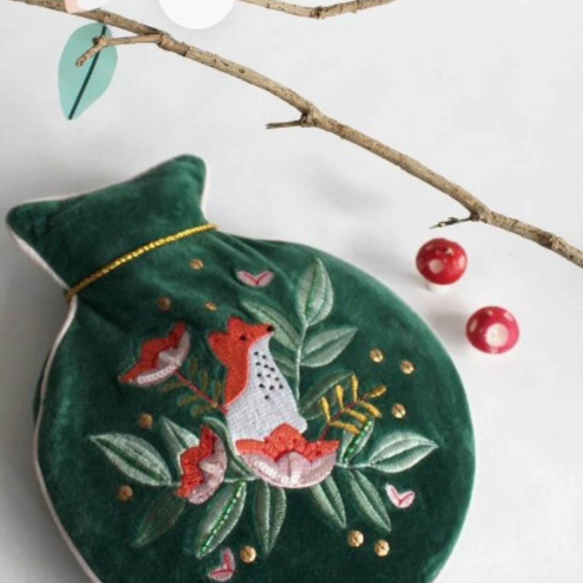 Dark green velvet round hot water bottle with embroidered fox and floral details, beads, sequins and gold tassel; 800ml included.