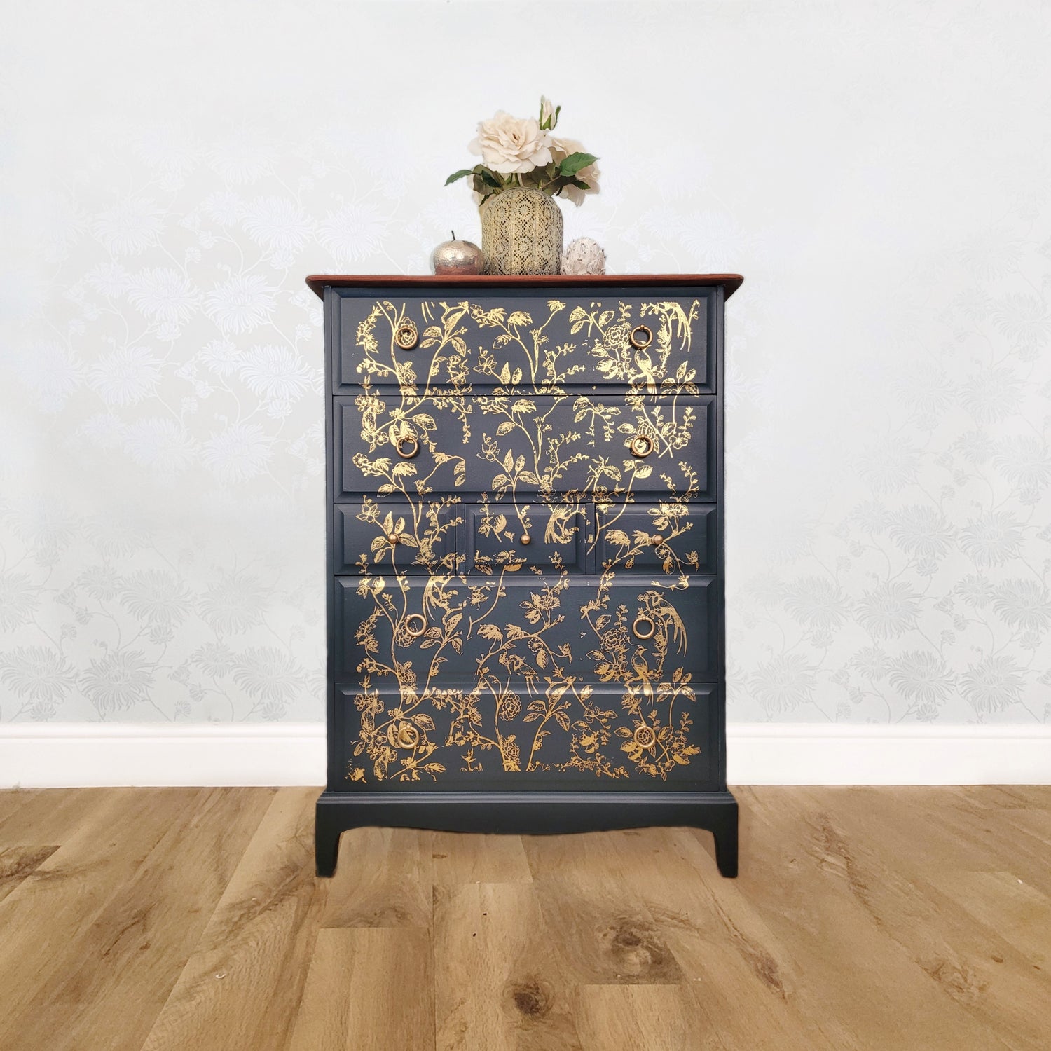 Stag Minstrel Tall Boy Seven Drawer Chest of Drawers with gold botanical and bird design