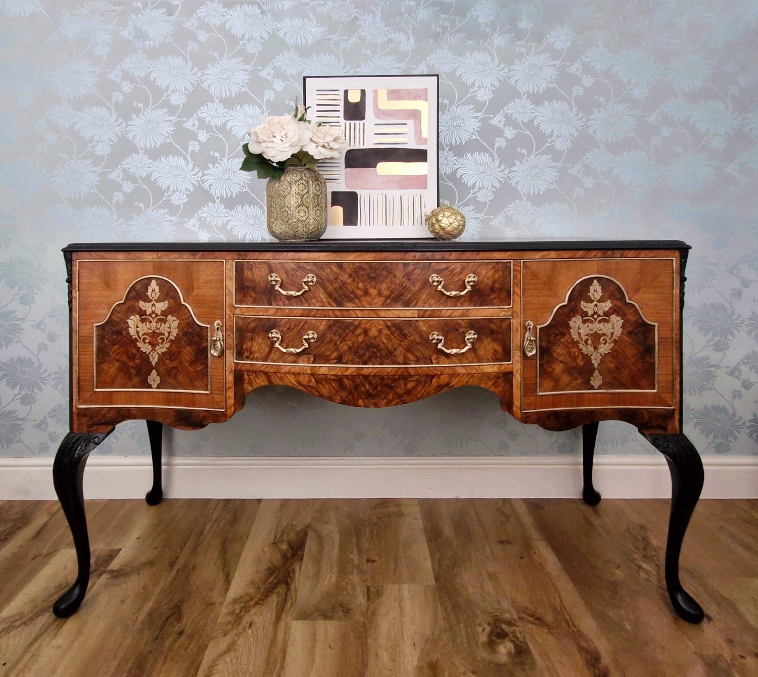 Walnut Queen Ann Style Sideboard with black curved legs and gold damask detail to the doors. Restored walnut wood grain and two central  drawers.