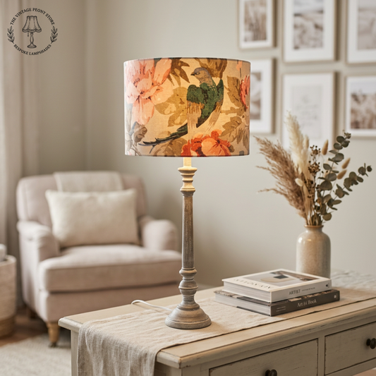 A drum table lampshade with a soft slow sitting on a coffee table