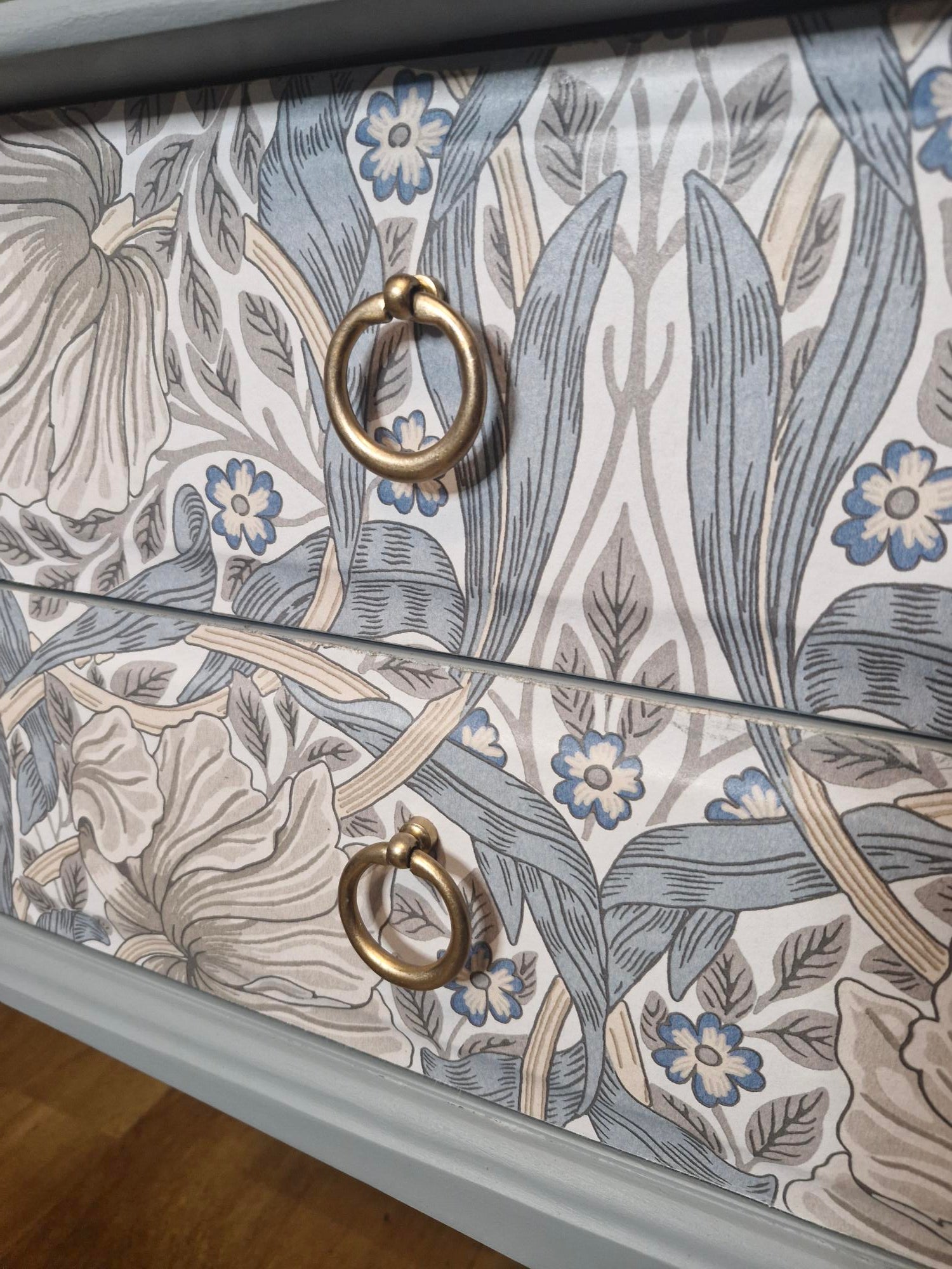 Detailed front drawer image showing original brass ring pull hardware