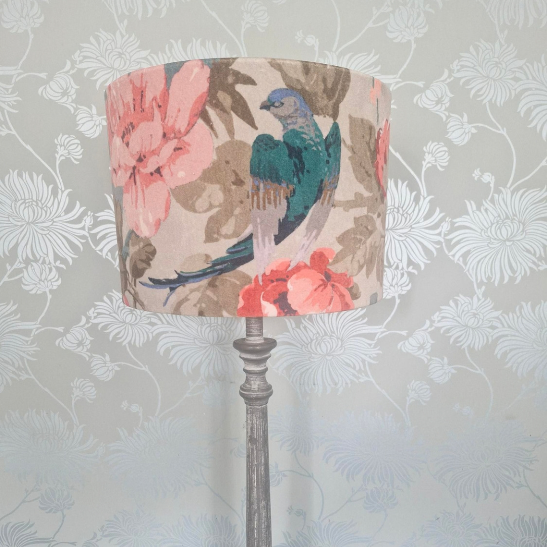 Linwood velvet 30cm drum lampshade against a floral blue wallpaper