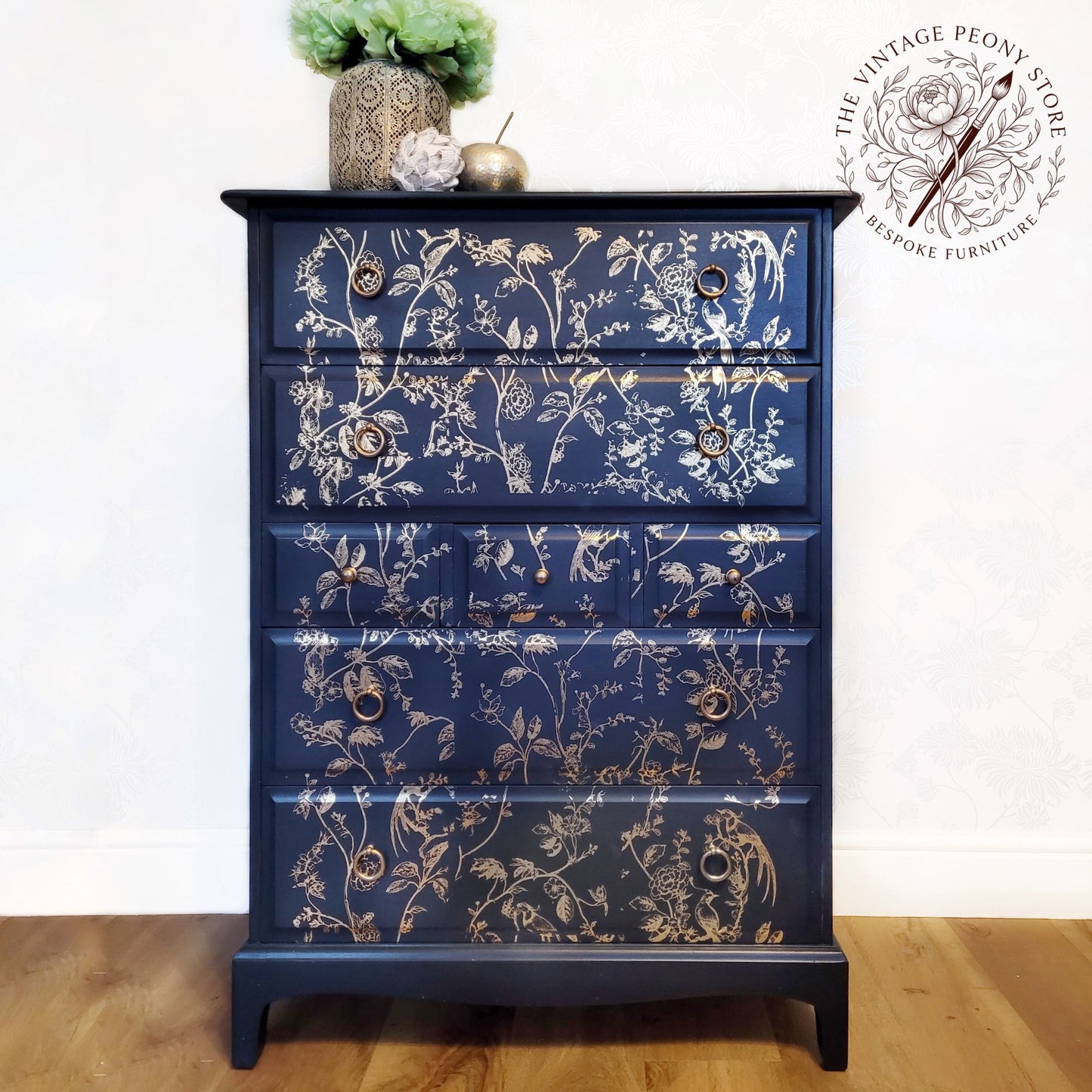 A Stag Minstrel tall boy hand painted in Fusion Mineral Paint Midnight Blue with gold botanical detail.