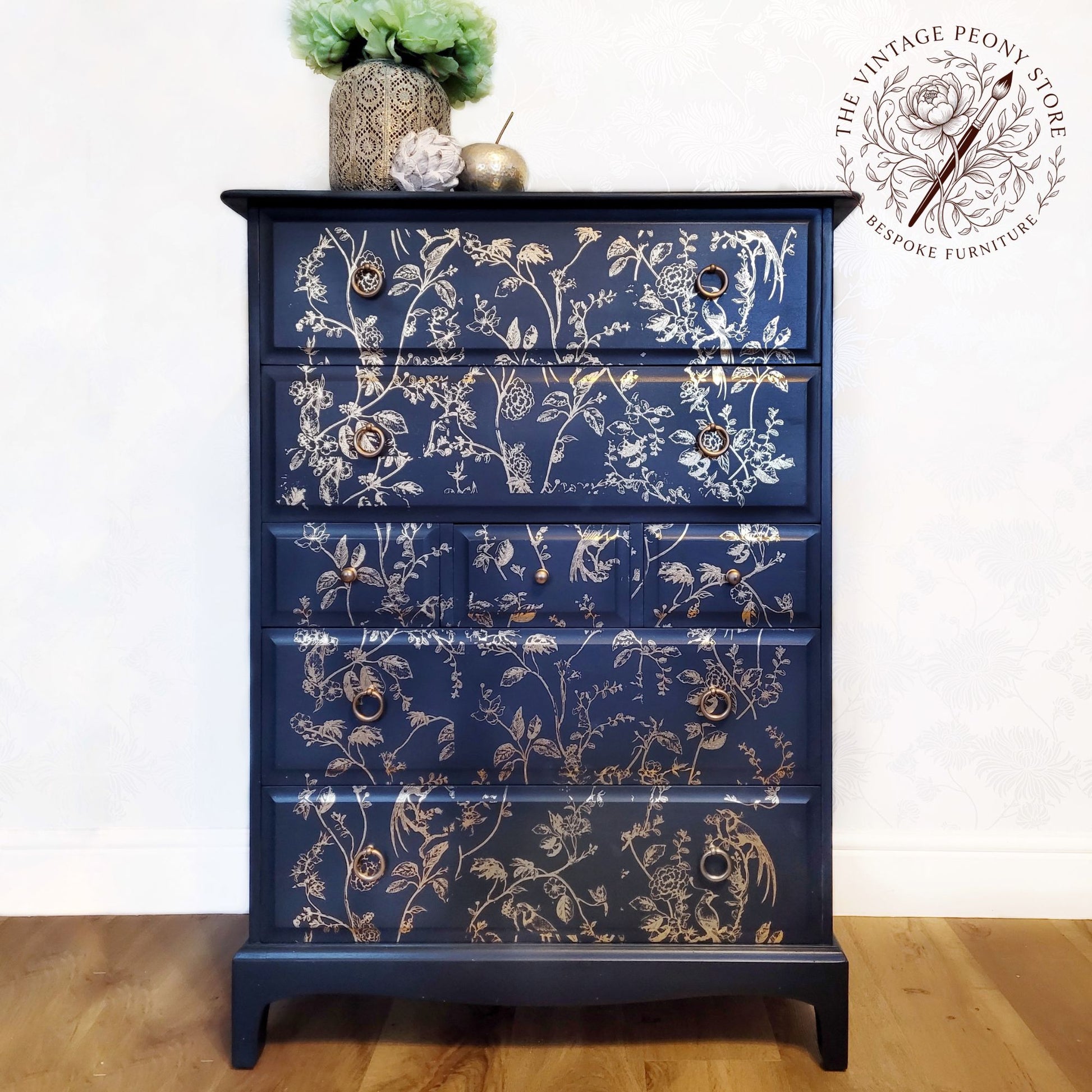 A Stag Minstrel tall boy hand painted in Fusion Mineral Paint Midnight Blue with gold botanical detail.