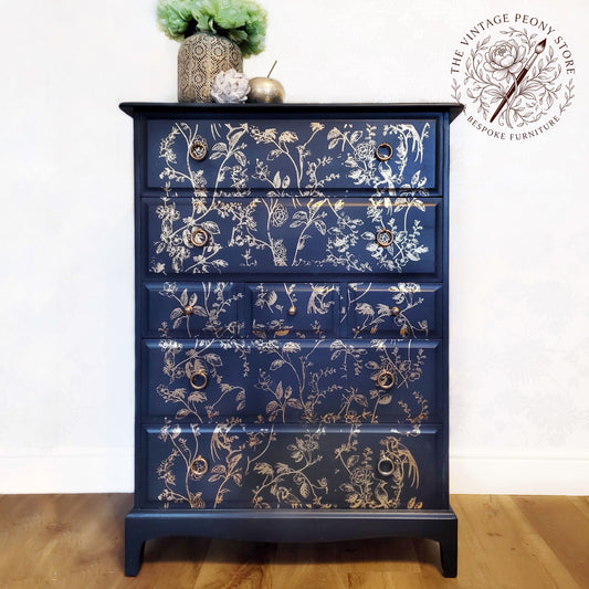 A Stag Minstrel tall boy hand painted in Fusion Mineral Paint Midnight Blue with gold botanical detail.
