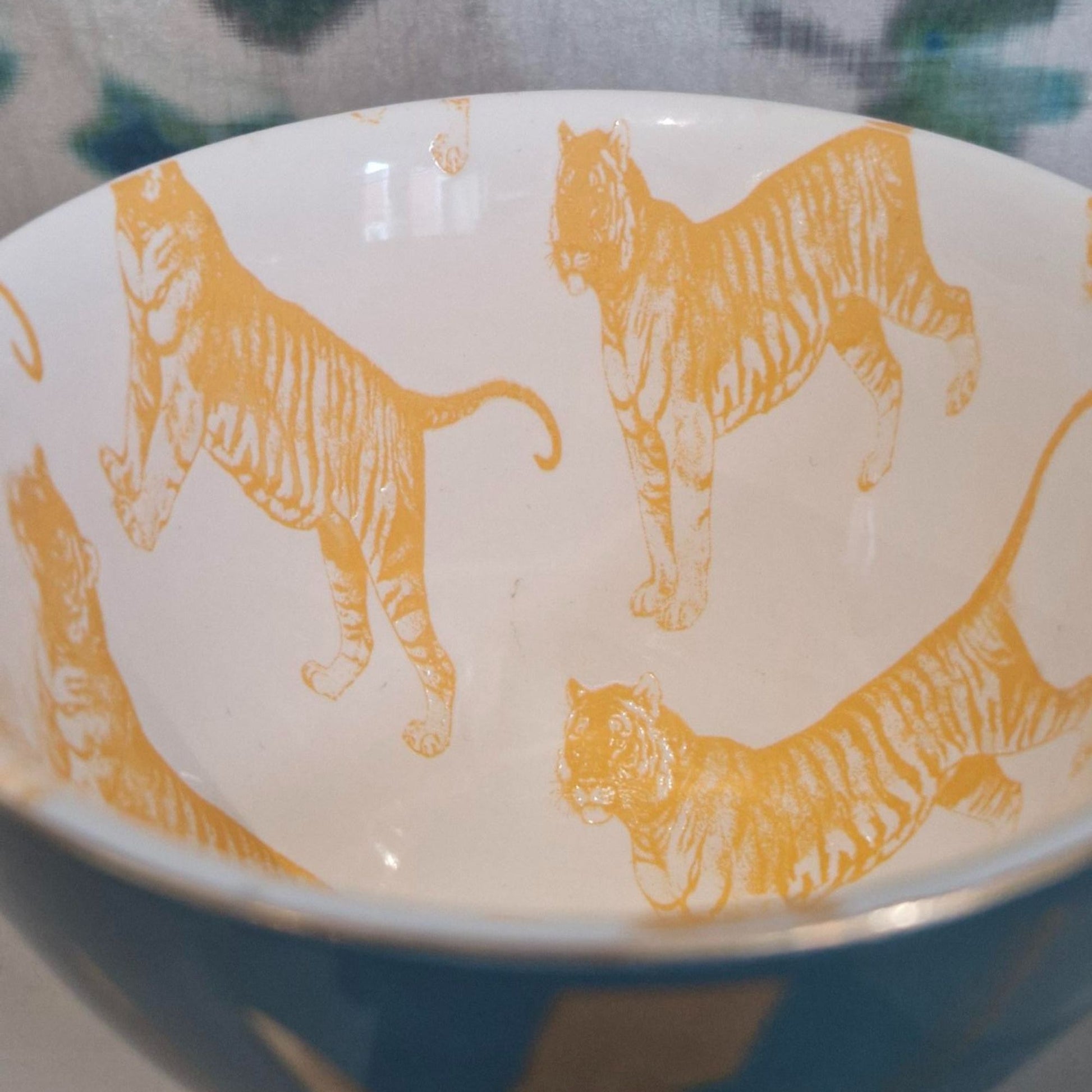 Ceramic mugwith orange tiger illustrations on a white background