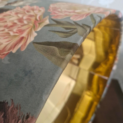 Close uop of botanical velvet fabric and gold inner