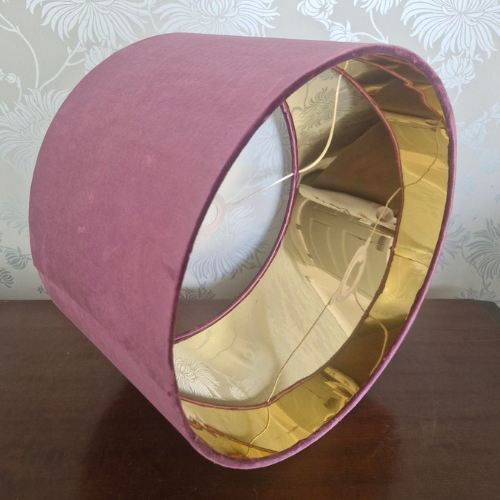 A mauve velvet 40cm diameter lampshade with gold metallic inner and white ring set