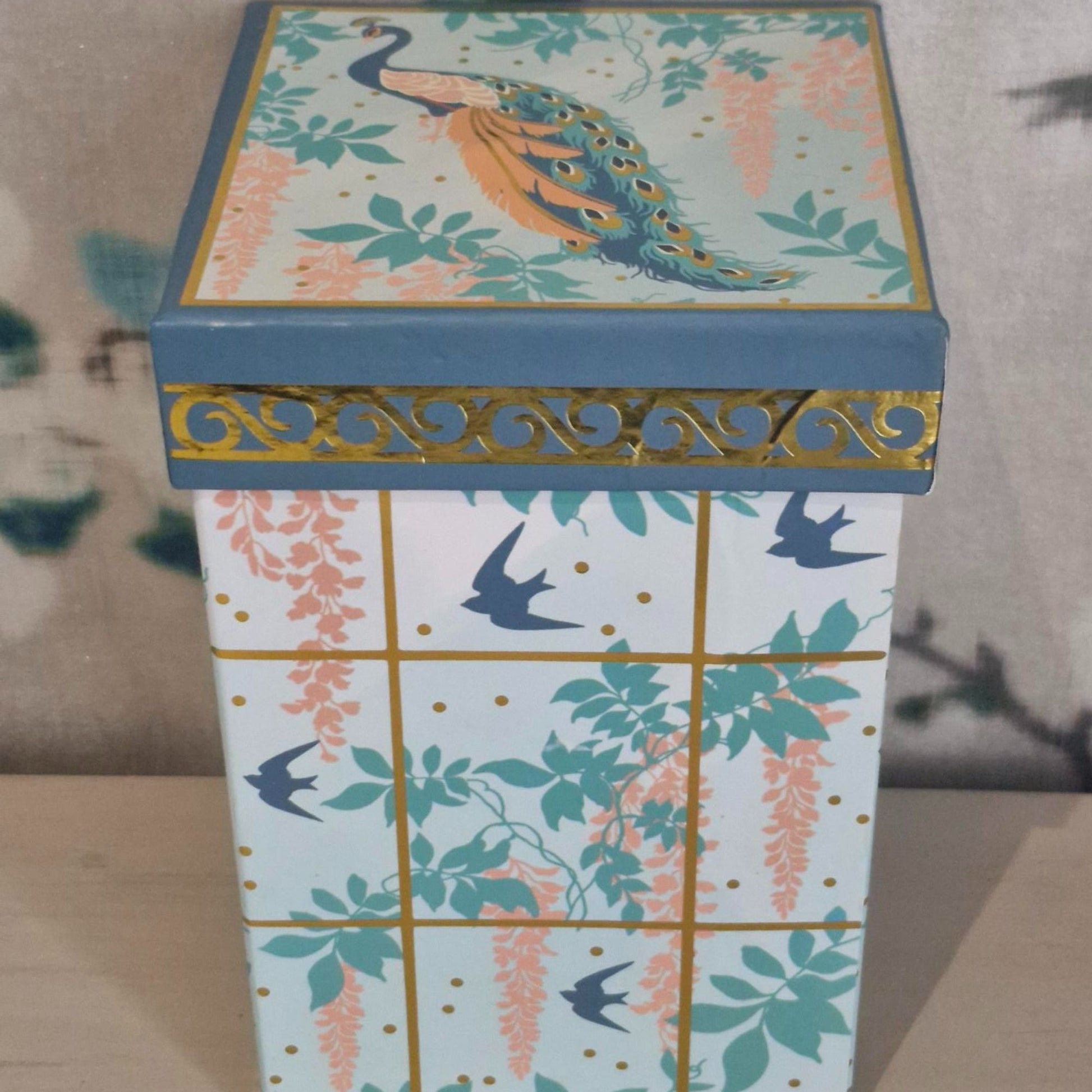 Decorative box showing wisteria, foliage and bird pattern.