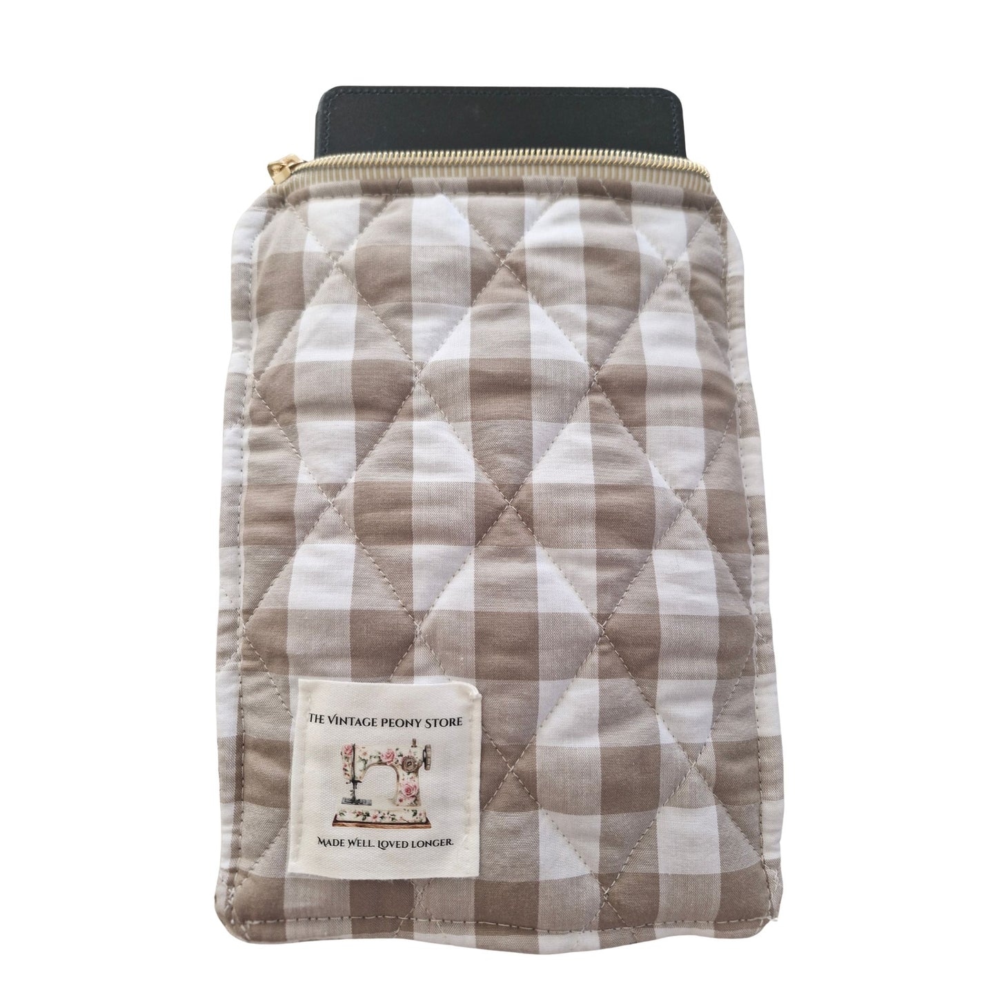 Quilted pouch with  sand checkered pattern and visible brand label on a white background