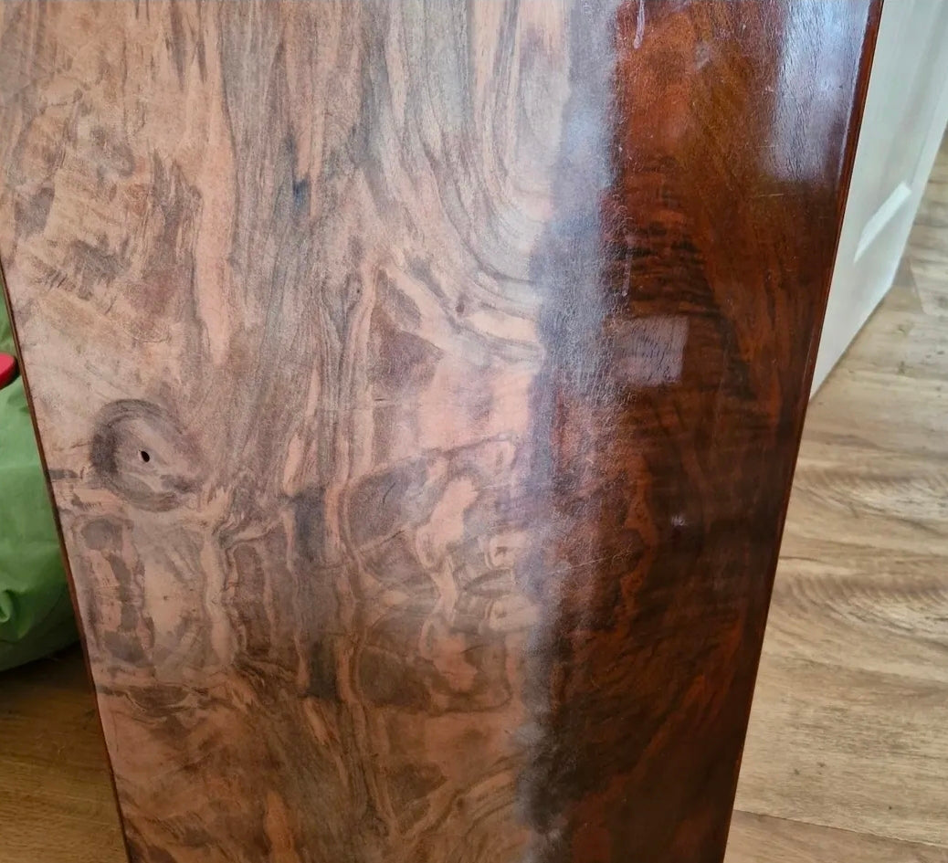 Close-up of a wooden surface with visible grain and texture