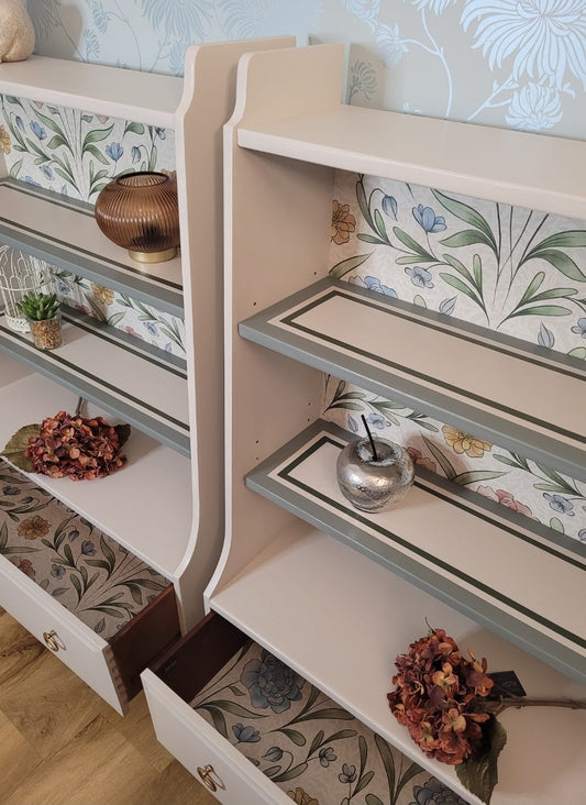 Custom Order - Beautifully upcycled green bookshelf with floral wallpaper backing. The shelves display decorative items and the bottom drawer features elegant gold ring pulls. Perfect for adding a touch of nature-inspired charm to any living room, bedroom, or hallway