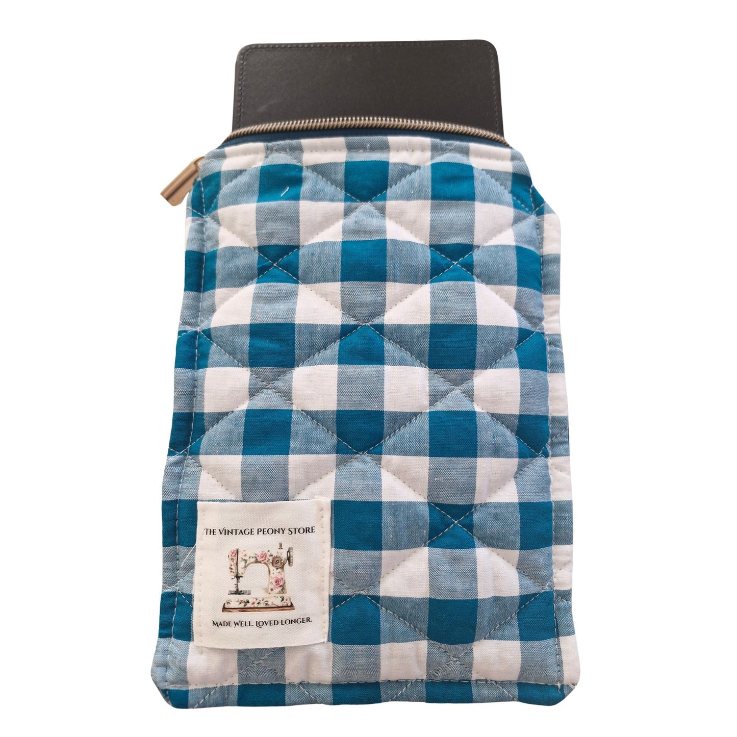 Teal and white checkered quilted pouch with a visible brand label on a white background