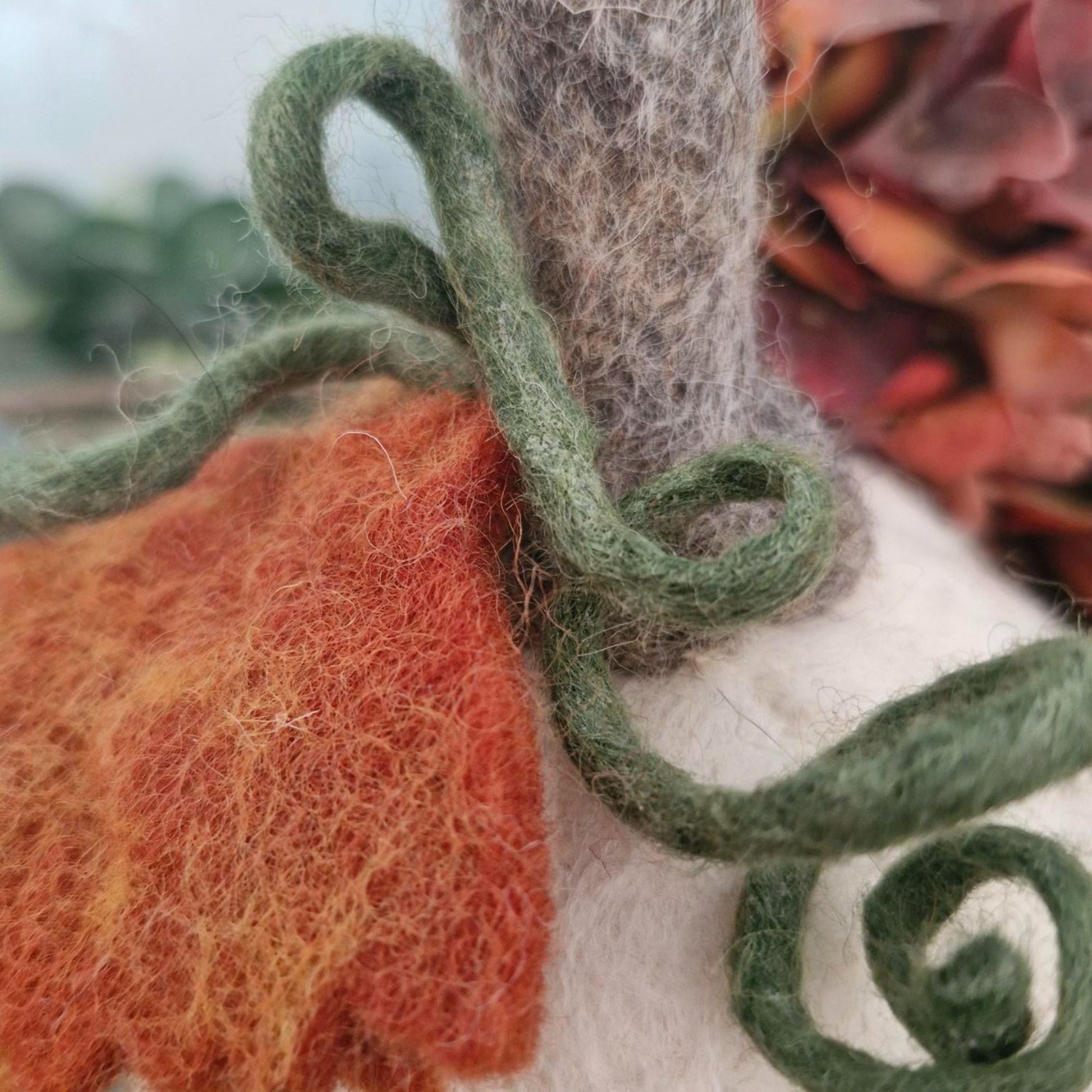 White and grey needle-felted wool pumpkin with leaf and upright stem, 11×11×15cm.