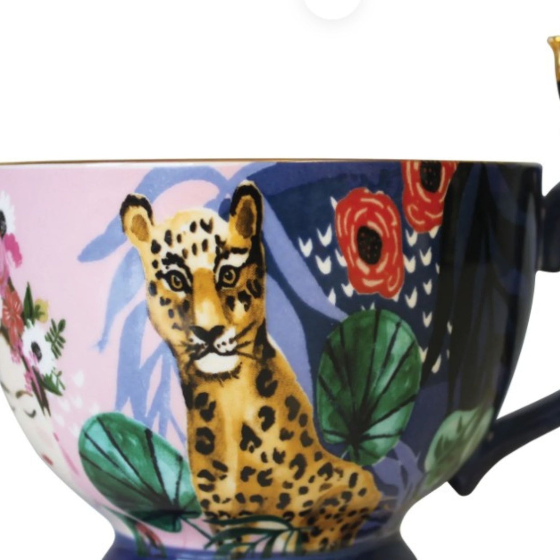 Frida Kahlo tropical porcelain mug with gold parakeet handle, gold signature and leaf print inside.