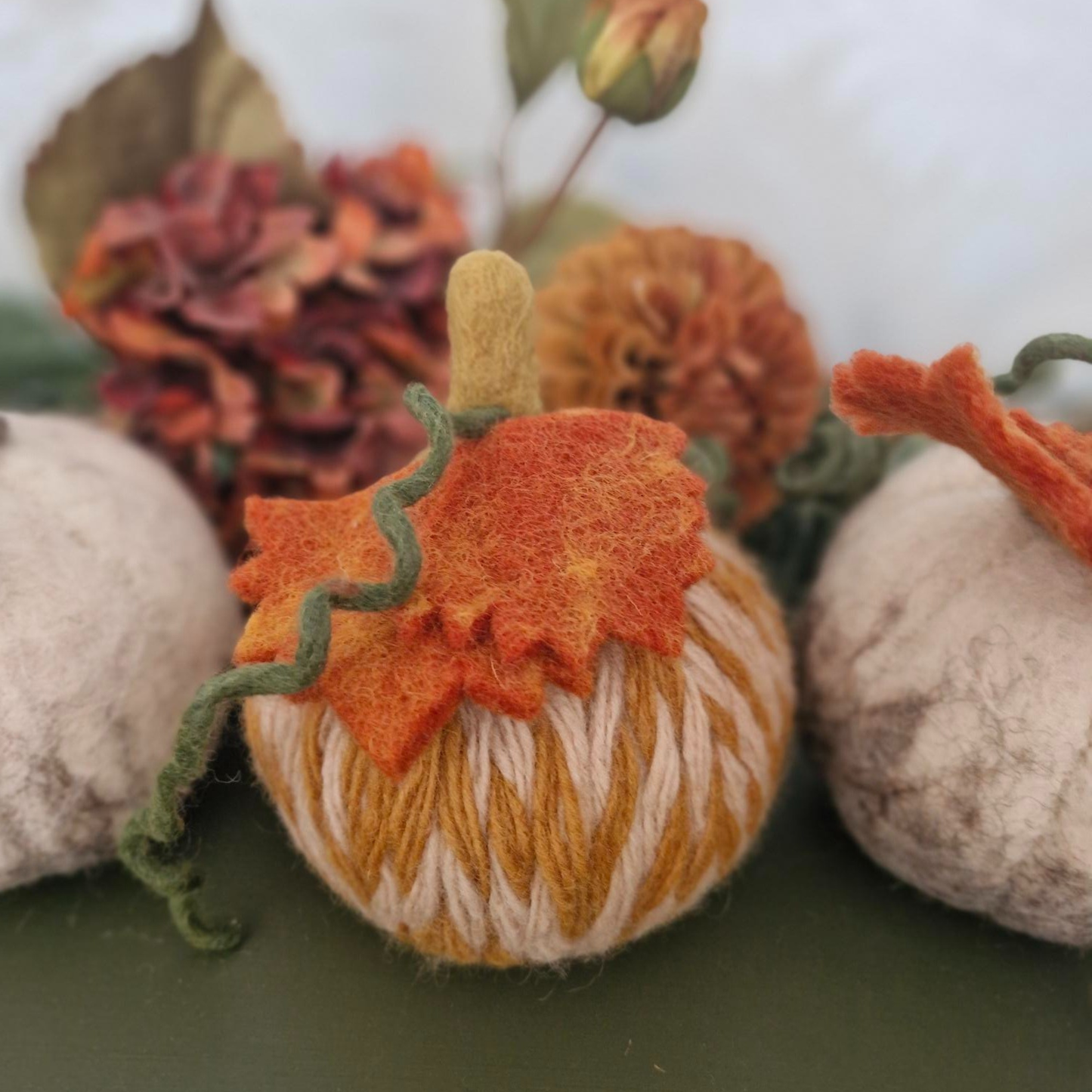 White and grey needle-felted wool pumpkin with leaf and upright stem, 11×11×15cm.