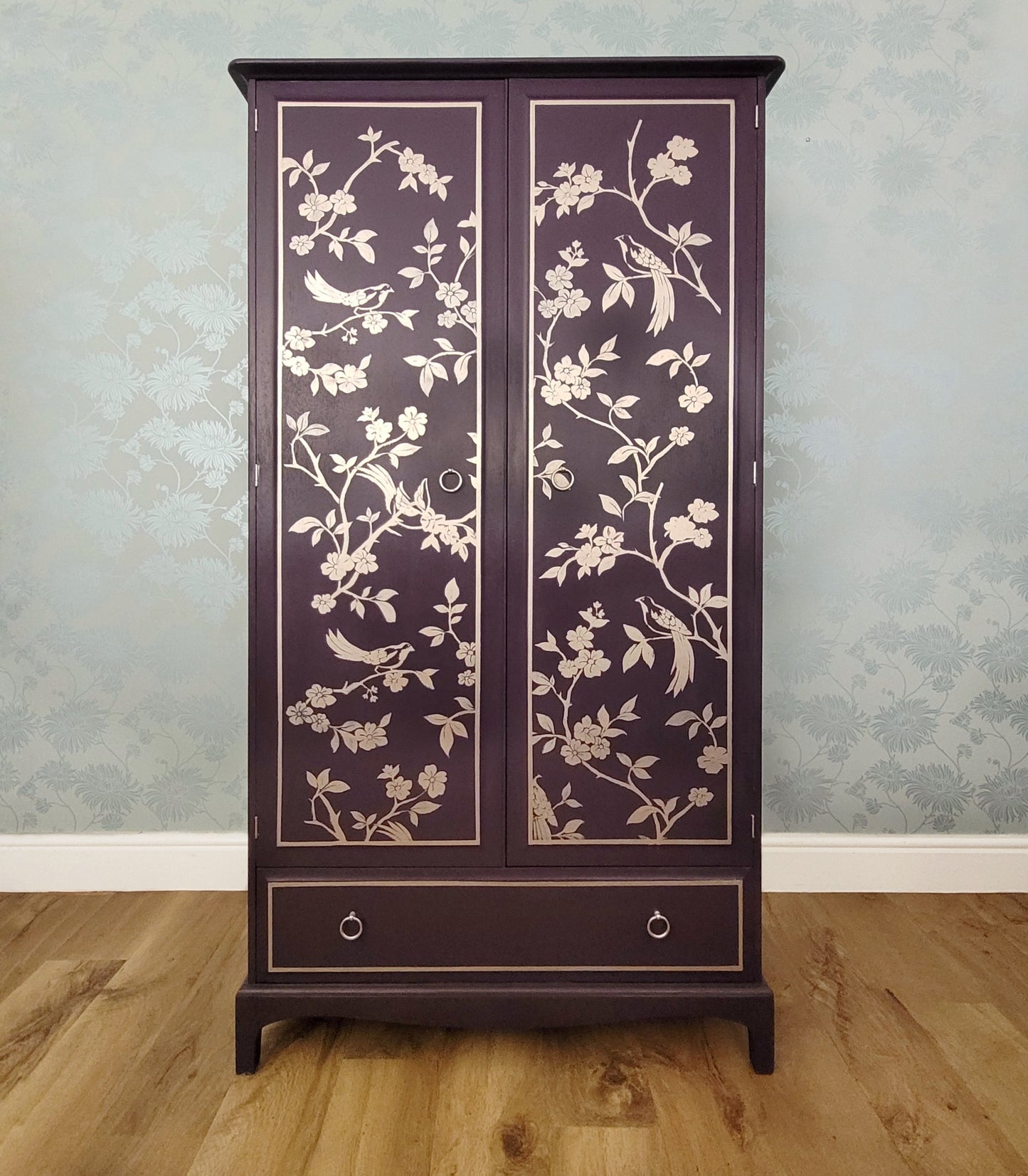 Front view of custom hand-painted Stag Minstrel double wardrobe in Fusion Mineral Paint Velvet Plum with gold chinoiserie design