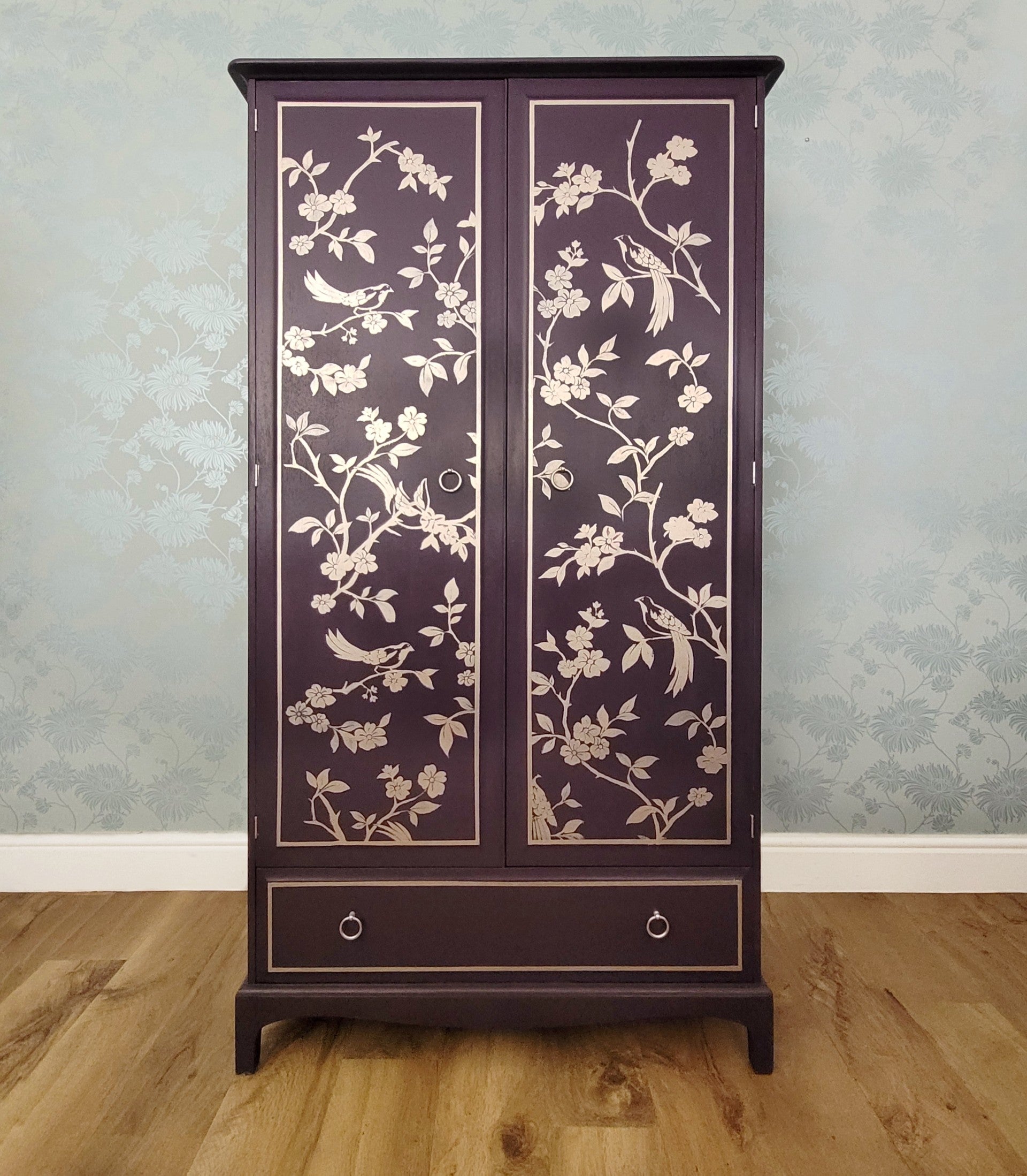 Front view of custom hand-painted Stag Minstrel double wardrobe in Fusion Mineral Paint Velvet Plum with gold chinoiserie design