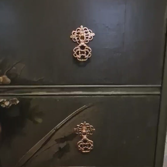 Ethereal fairy decoupage chest in mossy Bayberry with bronze hardware, styled in a calm bedroom setting.